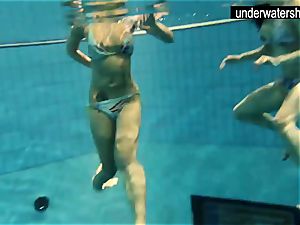 two cool amateurs showcasing their figures off under water
